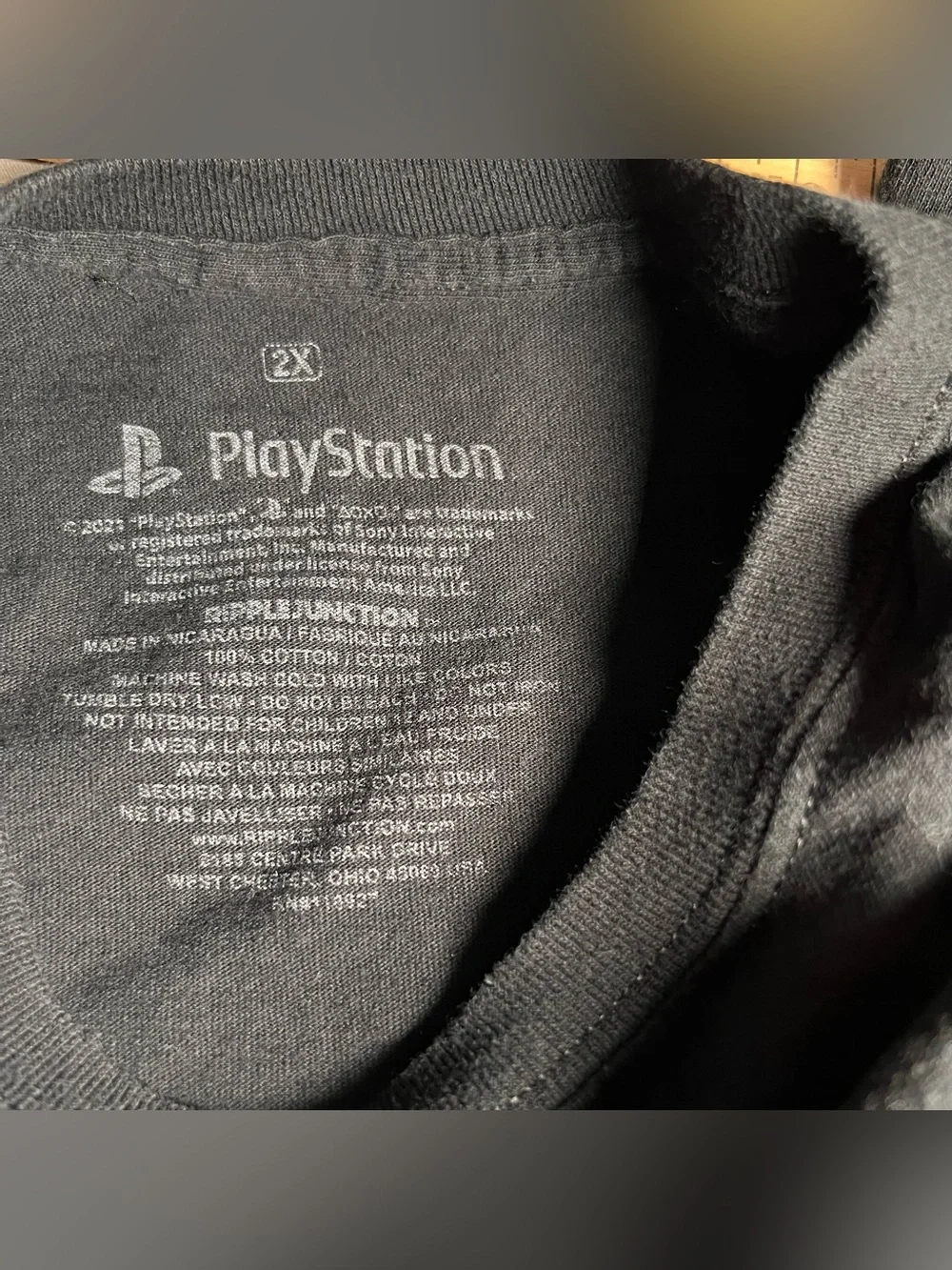 069 Sony Black Tee with Neon PlayStation Console Graphic